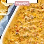 Cheesy hamburger dip with rotel and velveeta in a serving dish.