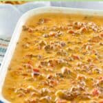Hamburger dip with rotel tomatoes in a serving dish.