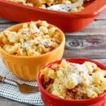 Copycat Longhorn Steakhouse mac and cheese in bowls and baking dish.