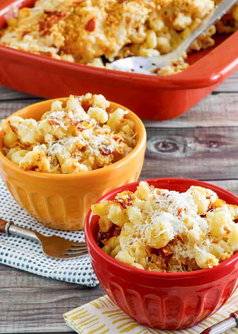 Copycat Longhorn Steakhouse mac and cheese in bowls and baking dish.