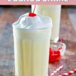 Homemade McDonald's eggnog shake with whipped cream and a cherry.