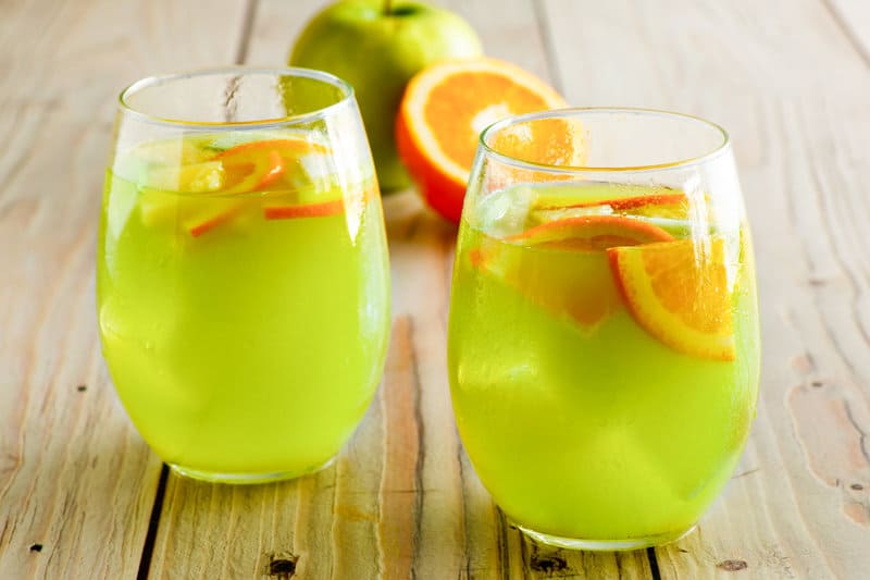 Copycat Olive Garden green apple moscato sangria with apple and orange slices.
