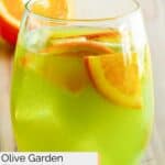 A glass of homemade Olive Garden green apple sangria.