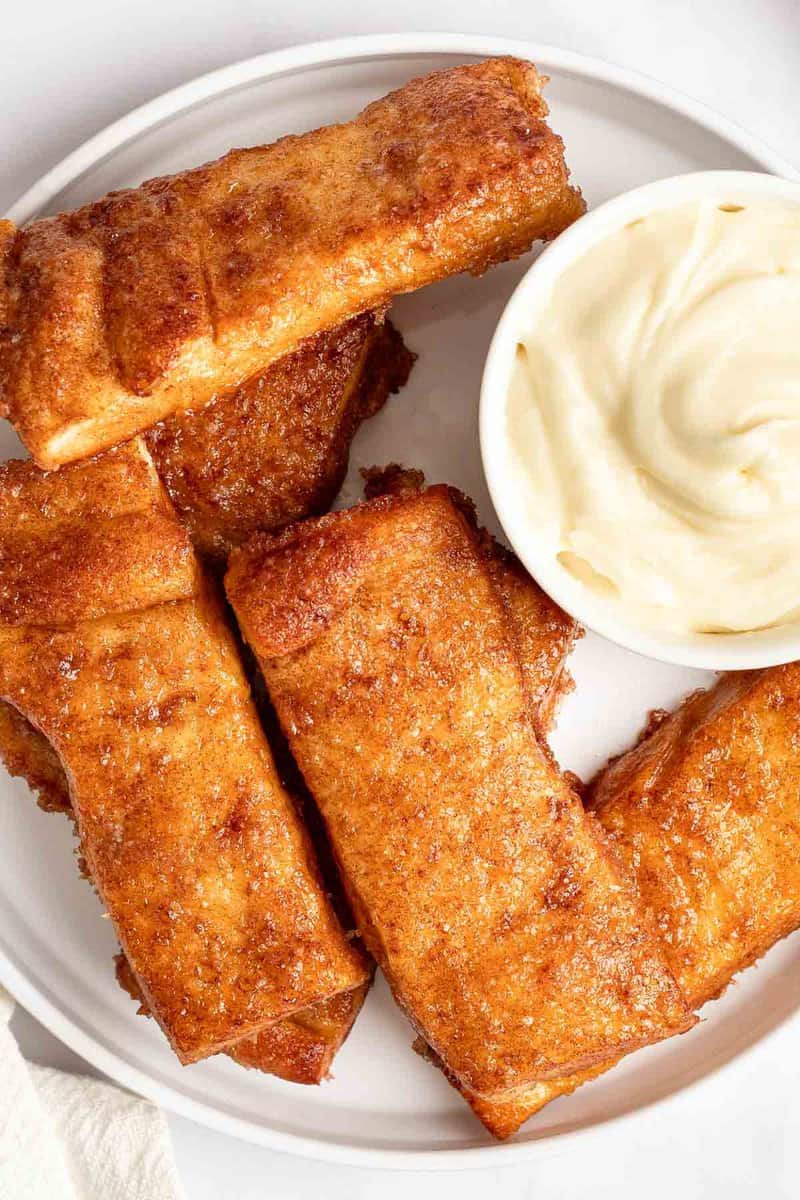 Copycat Pizza Hut cinnamon sticks with cream cheese icing dipping sauce.