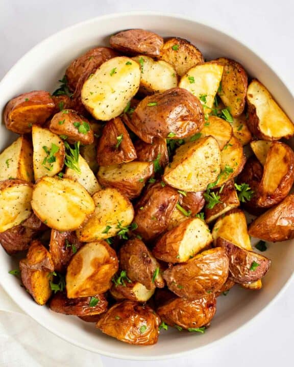Roasted red potatoes in a bowl.