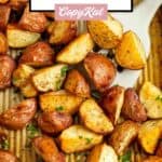 Roasted red potatoes on a baking sheet.