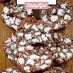 Pieces of homemade rocky road candy on a wood serving board.