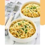 Bowls of homemade Spaghetti Warehouse spaghetti with garlic butter.