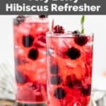 Two copycat Starbucks very berry hibiscus refresher drinks in tall glasses.