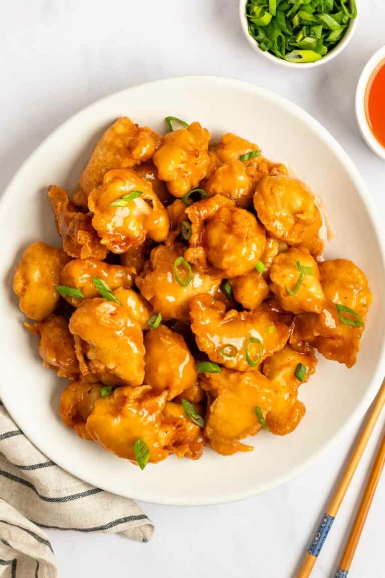 A plate of sweet and sour chicken.