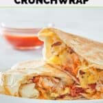Copycat Taco Bell breakfast crunchwrap with eggs, bacon, cheese, hashbrowns, and taco sauce.