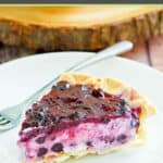 Homemade blueberry cream cheese pie slice on a plate.