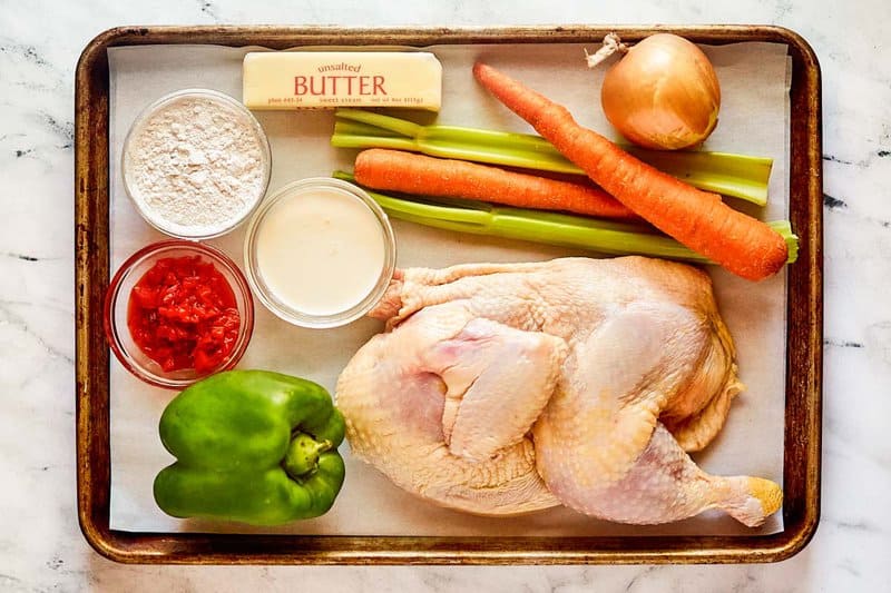 Chicken bisque ingredients on a tray.