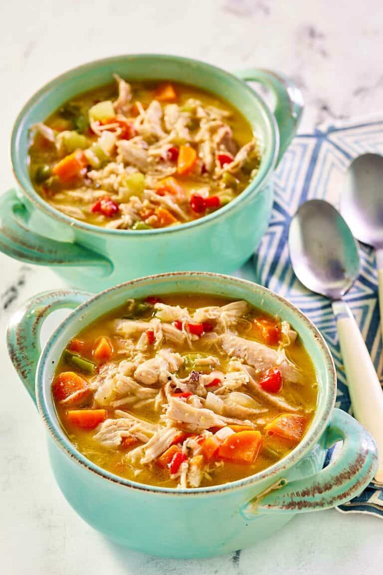 Chicken bisque in two soup crocks.