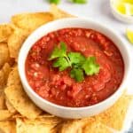 Copycat Chili's salsa and tortilla chips on a platter.