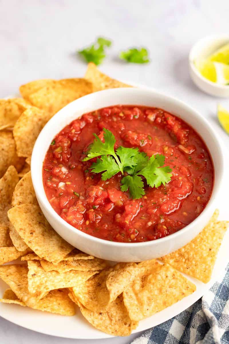 Copycat Chili's salsa and tortilla chips on a platter.