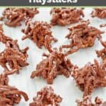 Chocolate butterscotch haystacks spread out on parchment paper.