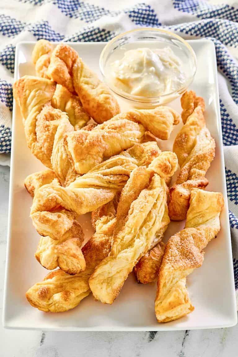 Copycat Cinnabon cinnamon sticks with cream cheese frosting dip.