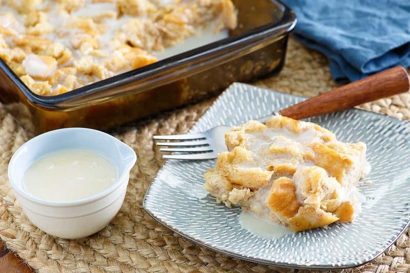 Copycat Golden Corral bread pudding topped with vanilla sauce.