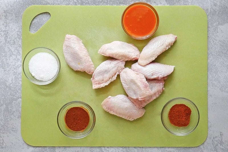Copycat Hooters wings ingredients on a cutting board.