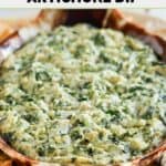Homemade Houston's spinach and artichoke dip in a serving dish on a platter.