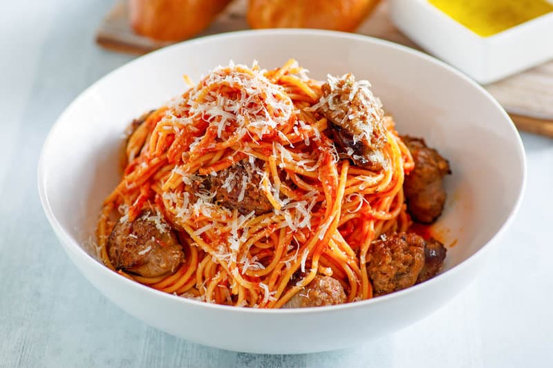 Instant Pot spaghetti with Italian sausage in a pasta bowl.