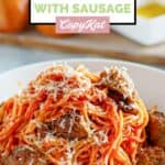 Instant Pot spaghetti with Italian sausage chunks in a bowl.