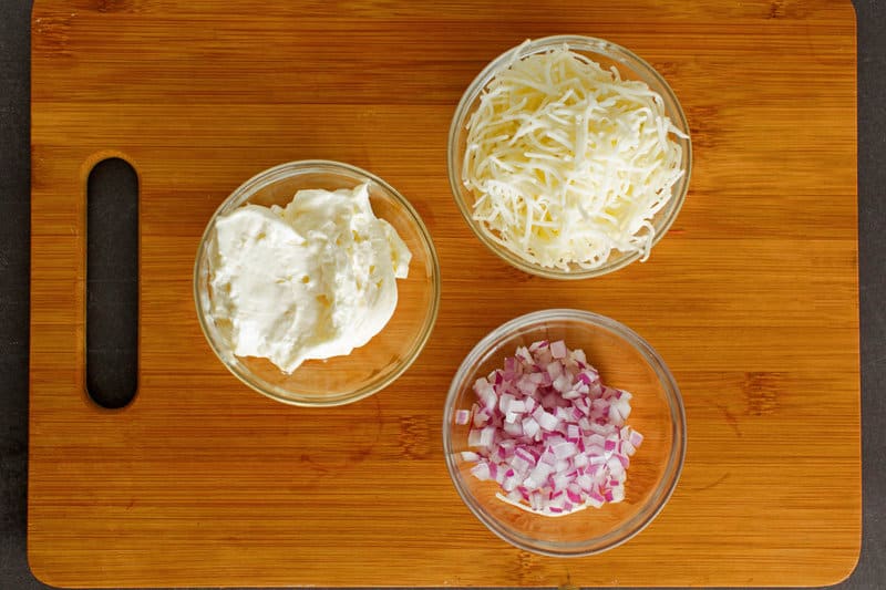 Copycat Kroger Jarlsberg cheese dip ingredients in bowls.