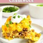 Mexican cornbread casserole and a fork on a plate.