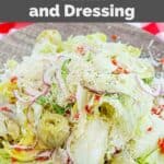 Copycat Pasta House salad with dressing on a plate.