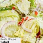 Homemade Pasta House Company salad with dressing.