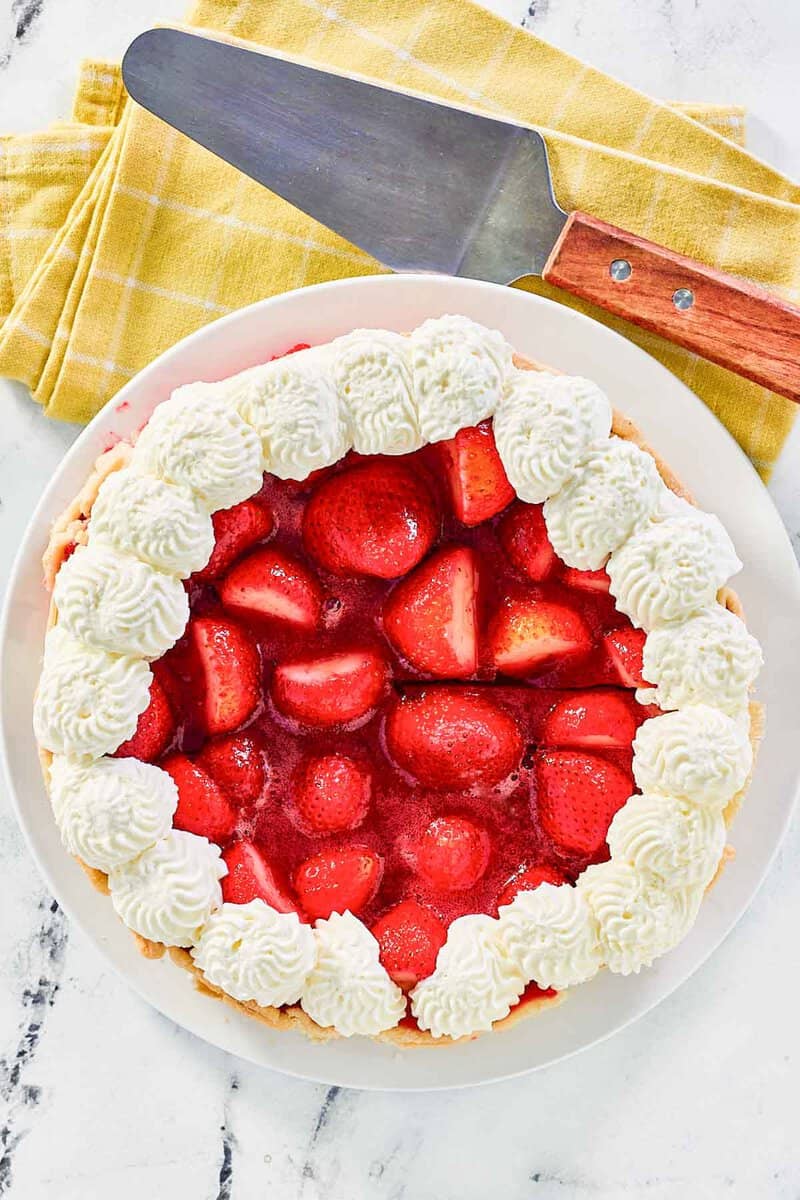 A whole copycat Shoney's strawberry garnished with whipped cream.