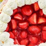 Homemade Shoney's strawberry pie garnished with whipped cream.