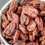 Spiced pecans in a bowl.