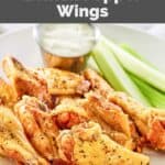 Homemade Wingstop lemon pepper wings, celery sticks, and a cup of dipping sauce.
