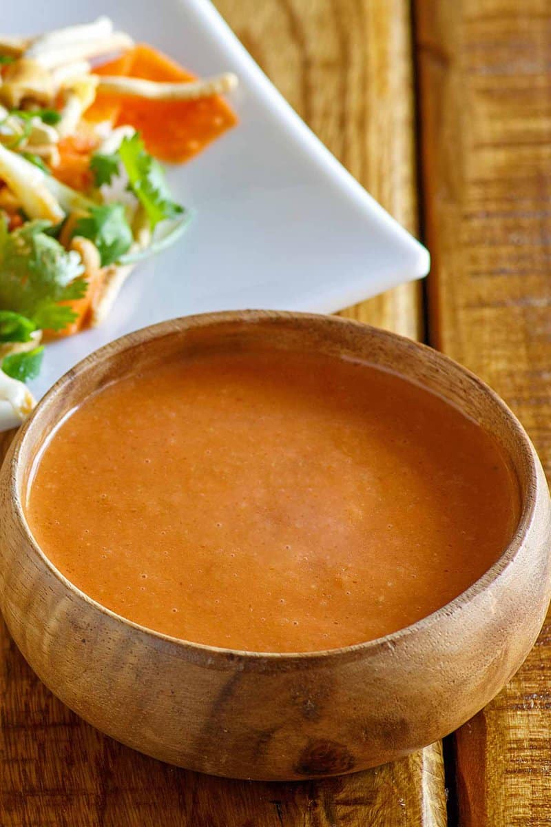 Copycat Benihana ginger salad dressing in a wood bowl.