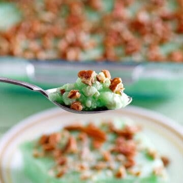 Copycat Furr's cafeteria lime jello salad on a spoon and plate and in a baking dish.