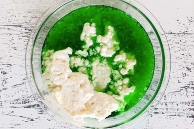 Lime jello and cottage cheese in a bowl.