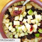 Homemade McDonald's fruit and maple oatmeal in a wood bowl.