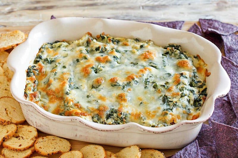 Copycat Olive Garden spinach artichoke dip in a baking dish.