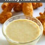Homemade Outback Steakhouse honey mustard on a tray with chicken fingers.