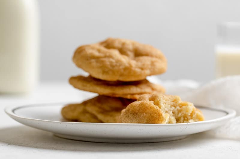 Four snickerdoodle cookies on a plate.