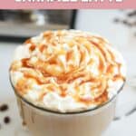 Homemade Starbucks caramel latte topped with whipped cream and caramel sauce.