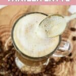 Homemade Starbucks vanilla latte and a spoon stirring it.