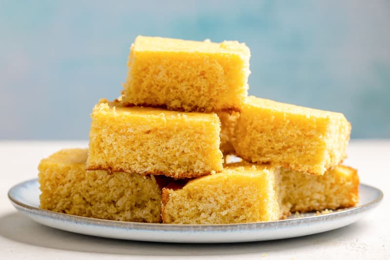 Copycat Tippin's cornbread slices piled on a plate.
