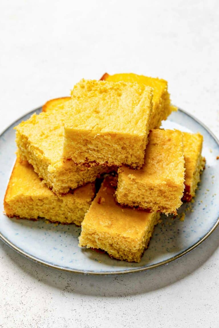 Copycat Tippin's cornbread slices stacked on a plate.