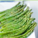 Air fried asparagus on a rectangular platter.