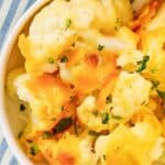 Baked cauliflower with cheese sauce in a bowl.