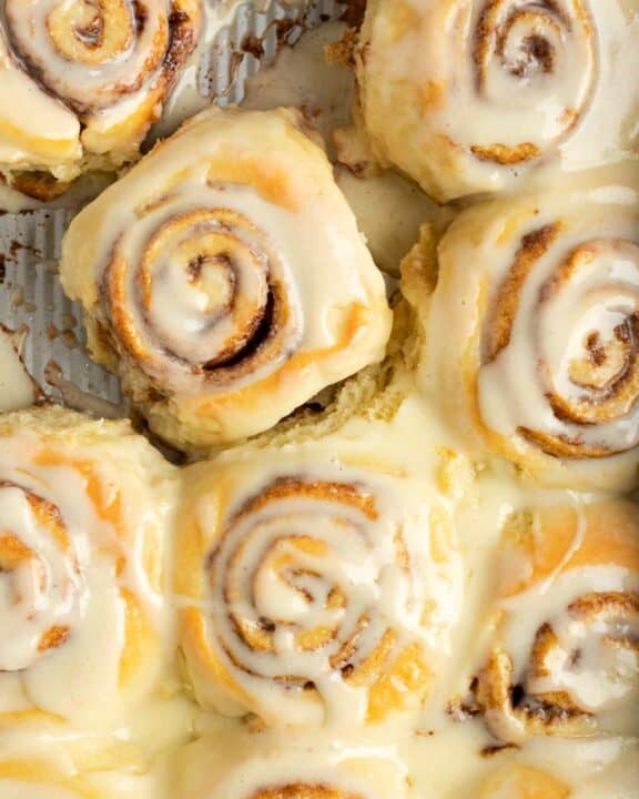 Copycat cinnamon rolls with frosting in a baking pan.