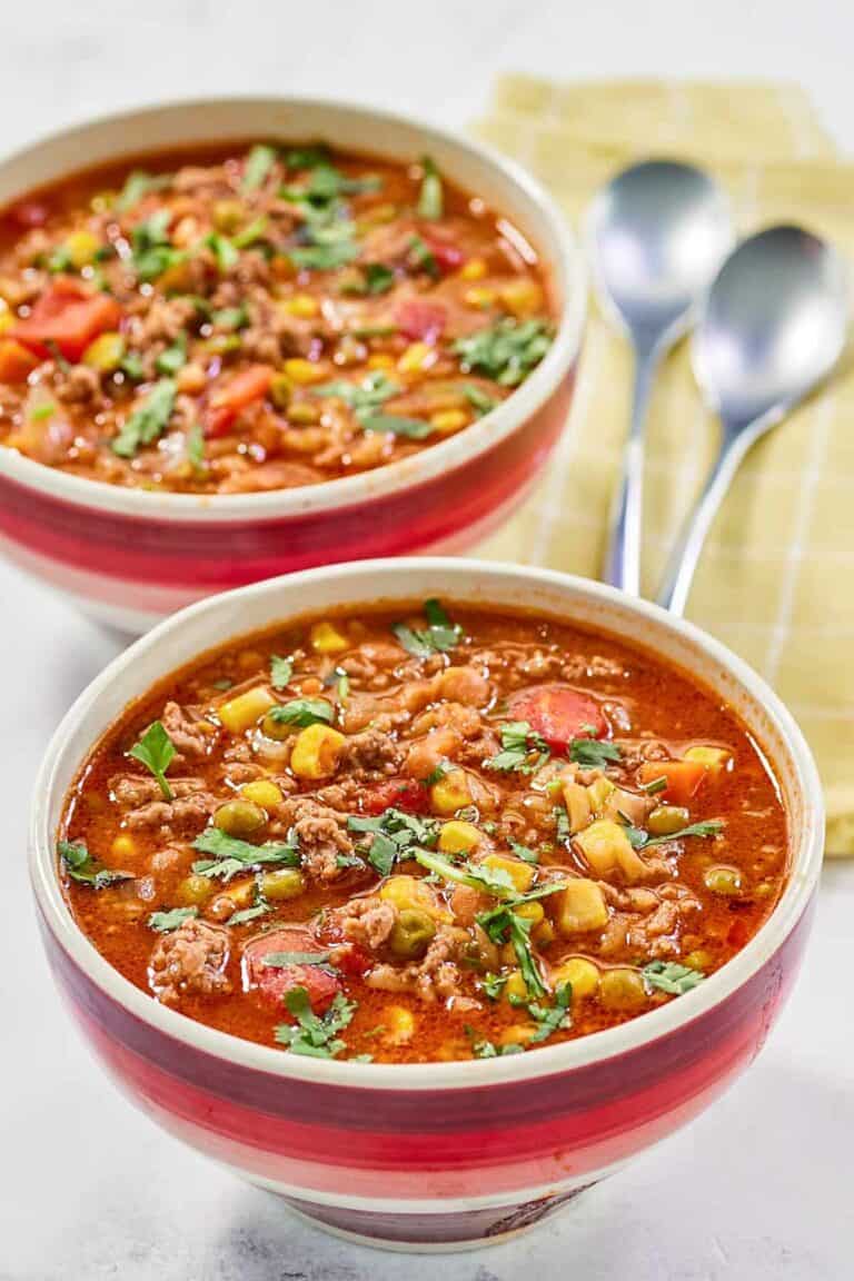 Cowboy soup garnished with fresh parsley.